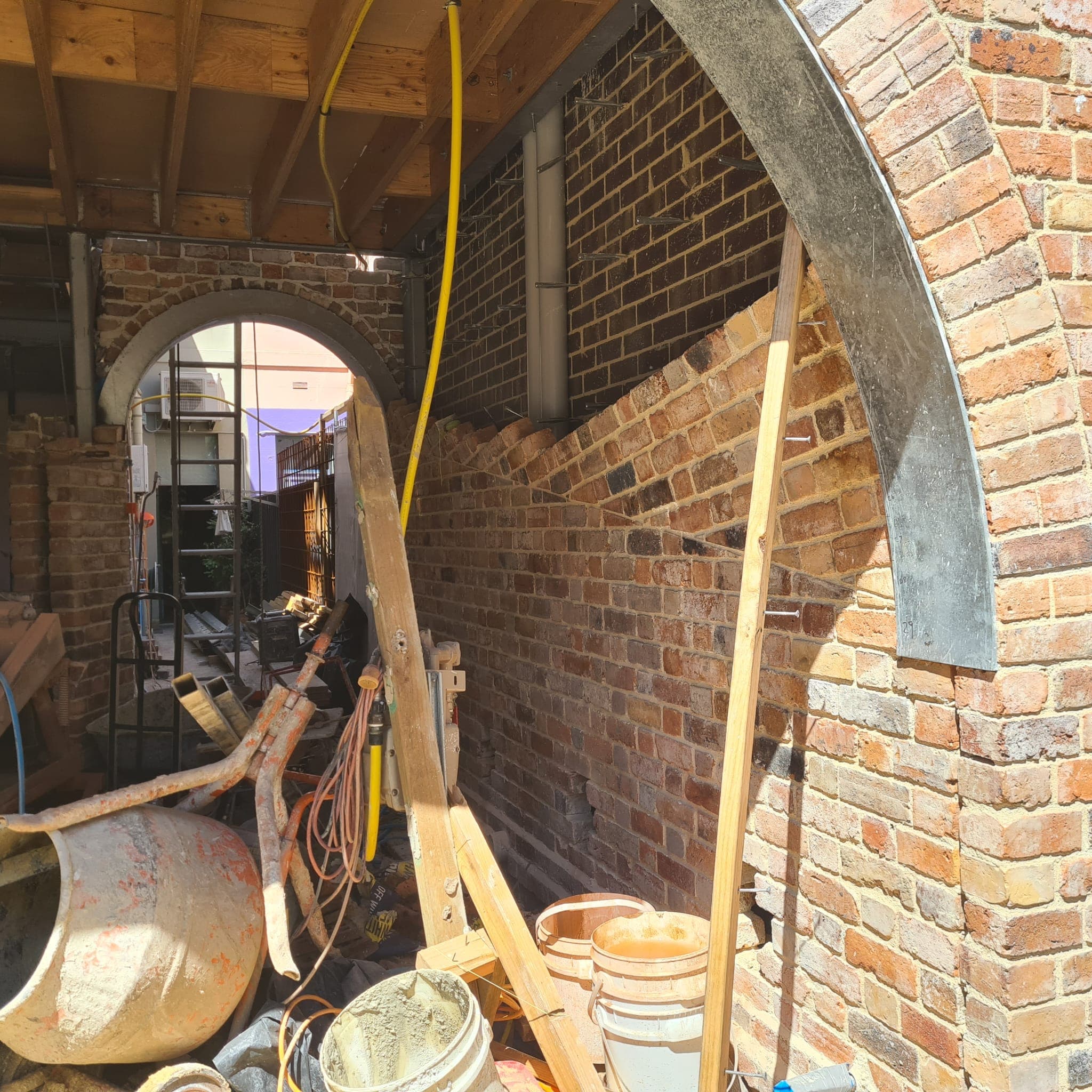 Hand-laid brick barrel vault under construction in Fitzroy by Goodwin Bricklaying