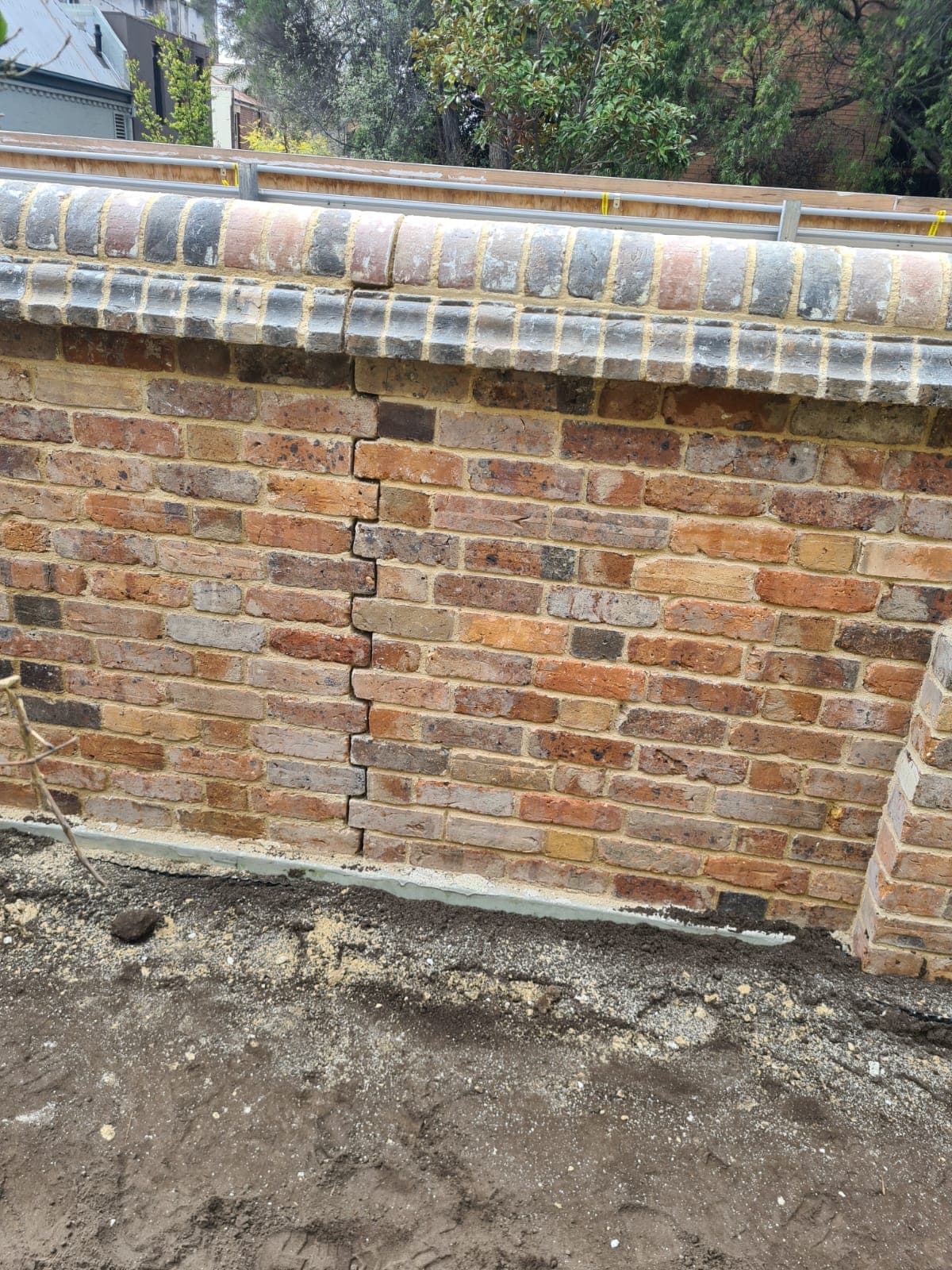 Structural heritage brick wall reconstruction in progress at the Cairo flats, Fitzroy by Goodwin Bricklaying