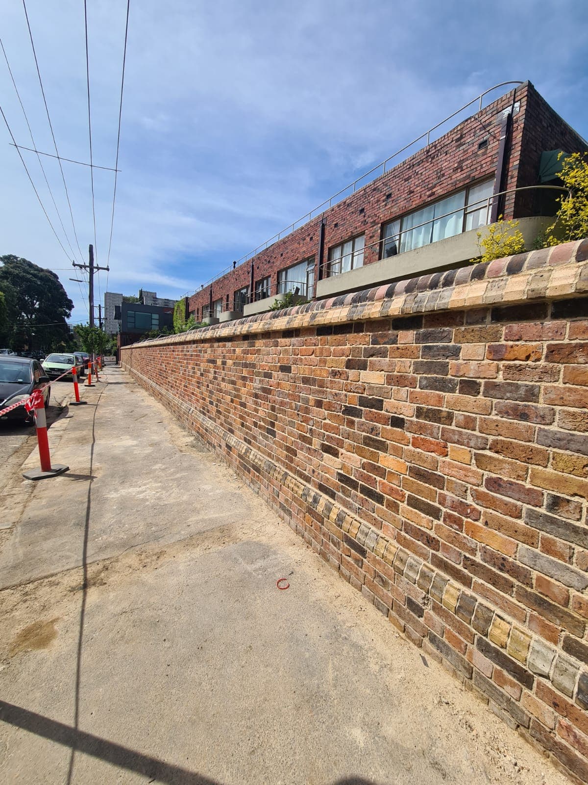 Restored heritage boundary wall at the Cairo flats on Hanover Street, Fitzroy by Goodwin Bricklaying