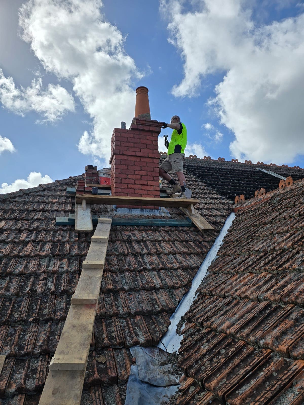 Heritage chimney stack restoration on a Glen Iris roof by Goodwin Bricklaying